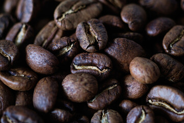Close-up of roasted coffee beans, top view.