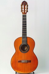 Obraz premium A simple guitar setup against a white background, symbolizing music as a hobby and a creative outlet.