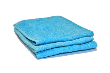 A large light blue terry towel lies on a PNG background.