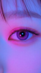 Close-up of a Woman's Eye with Neon Pink and Blue Lighting