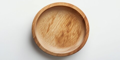 A simple and elegant setting featuring a wooden bowl sitting atop a white table