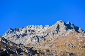 Scenic view of mountain panorama in the Swiss Alps at Engadin Valley seen from Swiss mountain village of Maloja on a sunny autumn day. Photo take November 15th, 2024, Maloja Bregaglia, Switzerland.