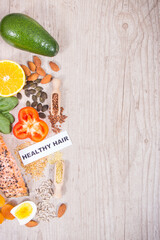 Nutritious products containing differents vitamins or minerals for healthy hair. Copy space for text