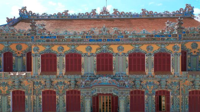 The vibrant Kien Trung Palace exhibits intricate architectural details and colorful designs, showcasing the artistic heritage of Hue Imperial City in Vietnam.