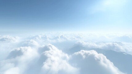 Fototapeta premium Aerial view of fluffy white clouds and mountains under a bright blue sky.