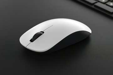 White computer mouse is sitting on a black desk