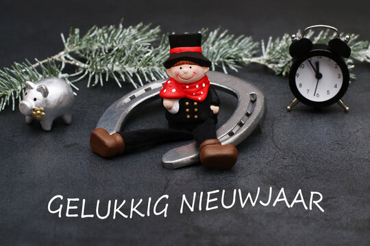 Nieuwjaarswenskaart: schoorsteenveger met hoefijzer en de tekst Gelukkig Nieuwjaar.