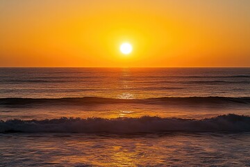 Obraz premium A serene sunset scene with warm orange and pink hues over the vast ocean waters, perfect for a relaxing atmosphere