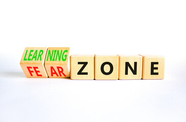 Learning or fear zone symbol. Concept words Learning zone Fear zone on wooden cubes. Beautiful white table white background. Business and learning or fear zone concept. Copy space.