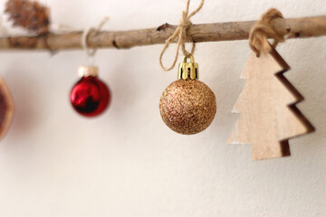 Cute Christmas tree ornaments, hanging on the branches. Selective focus. © jelena990