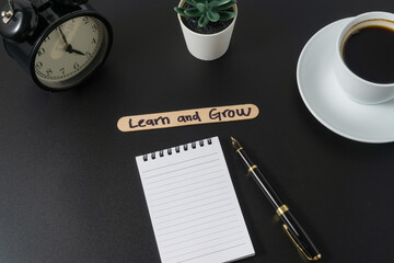 Business concept with a word Learn and Grow on black background