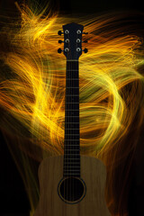 Acoustic guitar on black background