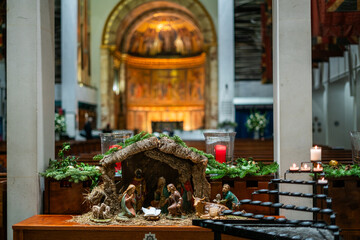 Beautiful Nativity Scene with Figurines Depicting the Birth of Jesus Christ and Village Life at the Guards Chapel church in London, England