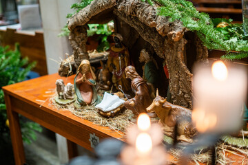 Beautiful Nativity Scene with Figurines Depicting the Birth of Jesus Christ and Village Life at the Guards Chapel church in London, England