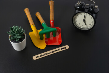 Gardening concept with a text World Environment Day on black background