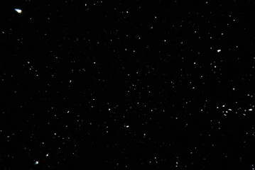 Sparkling snow snowdrifts close-up, perfect as a winter season white background or texture on black background