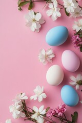 Colorful Easter eggs with flowering branches on a pink background create a festive display