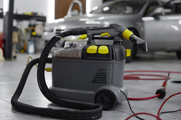 Closeup view on professional vacuum cleaner for car salon washing and cleaning