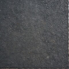 Dark granular rubber surface forming abstract background texture