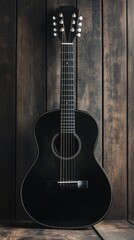 Fototapeta premium Black acoustic guitar stands against wooden background in a cozy setting