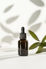 Naklejka premium Brown glass dropper bottle on white background with olive leaves shadow