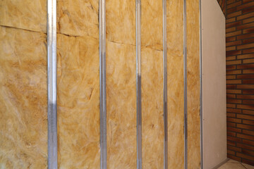 a new drywall with insulation and metal studs