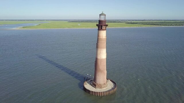 Aerial close up shot of Morris Island Lighthouse, an abandoned lighthouse near Folly Beach and Charleston, South Carolina.