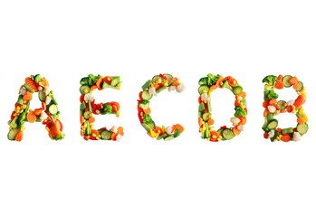 Vitamins A,E,C,D,B in the form of letters made of vegetables