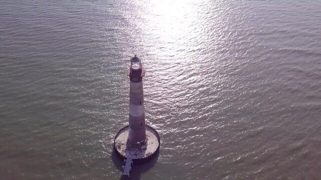 Aerial view of the Morris Island Lighthouse off the coast of Folly Beach in South Carolina.
