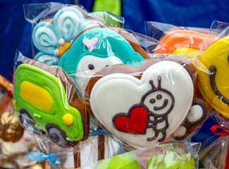 Glazed gingerbread cookies on a stick with various designs