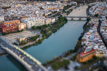 Obraz premium Beautiful sunset view of Triana Bridge in Seville with tilt-shift lens