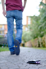 Man walking after losing his smart-phone