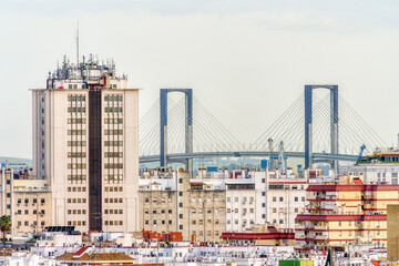 Urban Skyscraper with Iconic Bridge in the Background of Seville, Spain