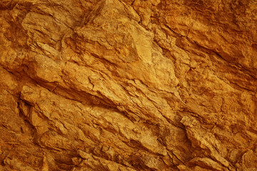 Orange brown red fire gold yellow stone surface. Mountain rock sandstone. Close-up. Bright. Blank template design.
