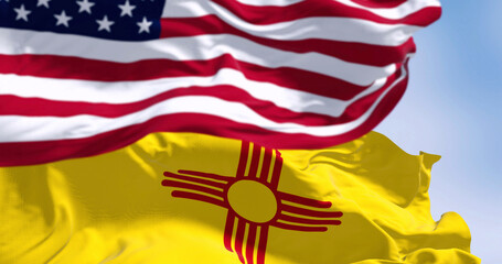 Close-up view of the New Mexico and United States flags waving