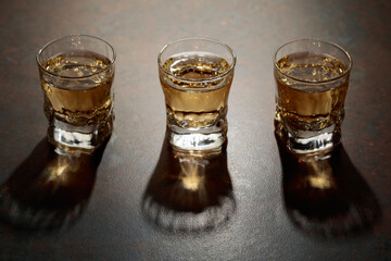 Small glasses of strong alcoholic drink.