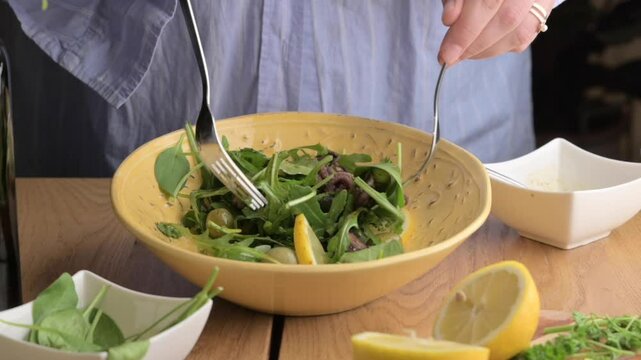 Fresh Octopus Salad with Herbs and Vinaigrette Mediterranean Culinary Delight. A vibrant Mediterranean-style octopus salad, prepared with fresh herbs, greens, and a zesty vinaigrette dressing