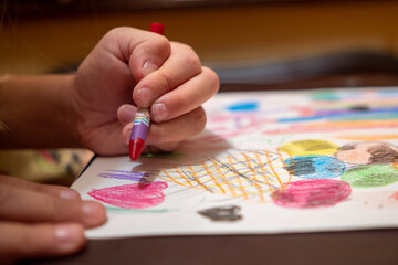 Draw with colored pencils on a white sheet of paper.