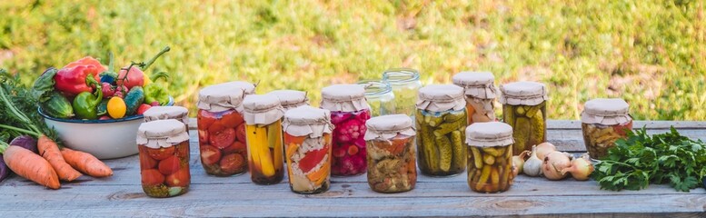 canning vegetables in jars. Selective focus