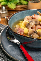 Sour soup with mushroom and potatoes.