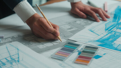 Indian business man designer architect engineer constructor drawing building plan sketch...
