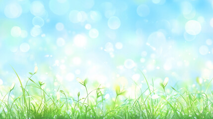 Obraz premium Stunning spring meadow with soft sunlight, blooming pink wildflowers, and fresh green grass against a dreamy blue sky with bokeh light effects. Perfect for seasonal and nature-themed designs