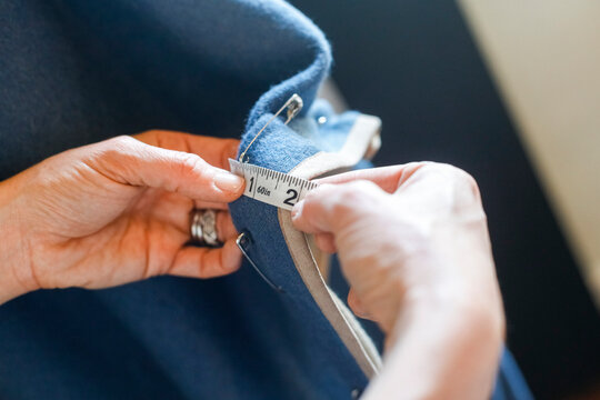 Millbrook, New York, USA Designer measuring fabric