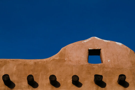 Taos, New Mexico, United States. Adobe structure with protruding vigas