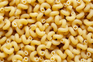 Spirali dried pasta background backdrop. Italian food ingredients concept.
