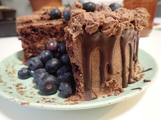 sweet decorated chocolate cake with blueberries