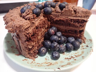 sweet decorated chocolate cake with blueberries