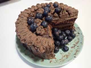 sweet decorated chocolate cake with blueberries