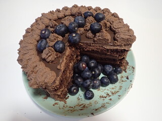 sweet decorated chocolate cake with blueberries