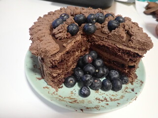 sweet decorated chocolate cake with blueberries